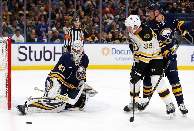 Matt Beleskey of the Boston Bruins and Robin Lehner of the Buffalo Sabres