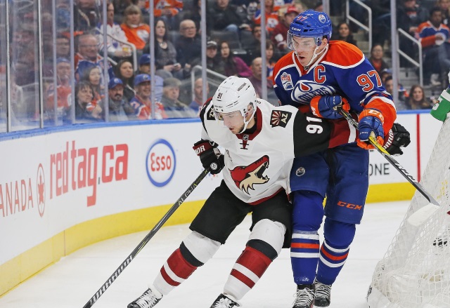 Connor McDavid of the Edmonton Oilers and Alex Burmistrov of the Arizona Coyotes