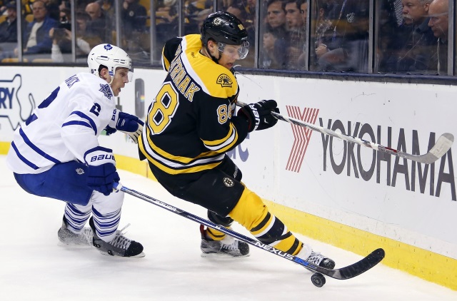 David Pastrnak of the Boston Bruins and Matt Hunwick of the Toronto Maple Leafs