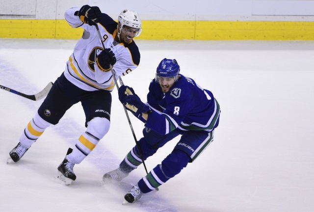 Evander Kane of the Buffalo Sabres and Chris Tanev of the Vancouver Canucks