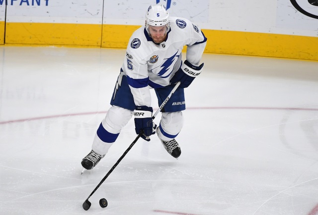 Dan Girardi appears to be okay after taking a shot up high