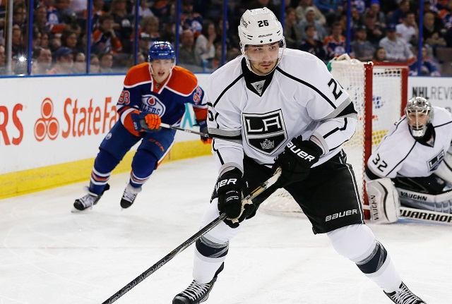 Slava Voynov of the Los Angeles Kings and Ryan Nugent-Hopkins of the Edmonton Oilers