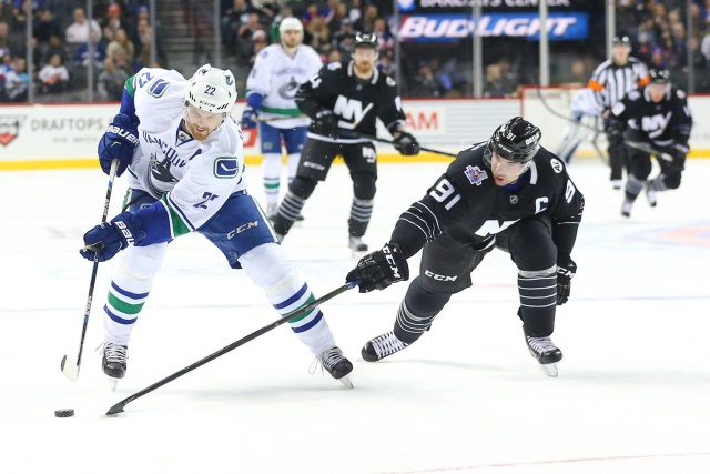 John Tavares of the New York Islanders and Daniel Sedin of the Vancouver Canucks