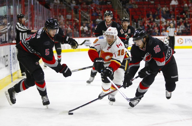 Noah Hanifin and Elias Lindholm