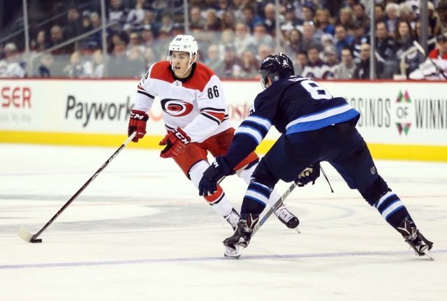 Jacob Trouba of the Winnipeg Jets and Teuvo Teravainen of the Carolina Hurricanes