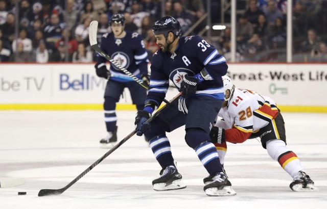 Winnipeg Jets Dustin Byfuglien practices in a regular jersey.