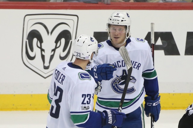 Vancouver Canucks Alex Edler and Brock Boeser