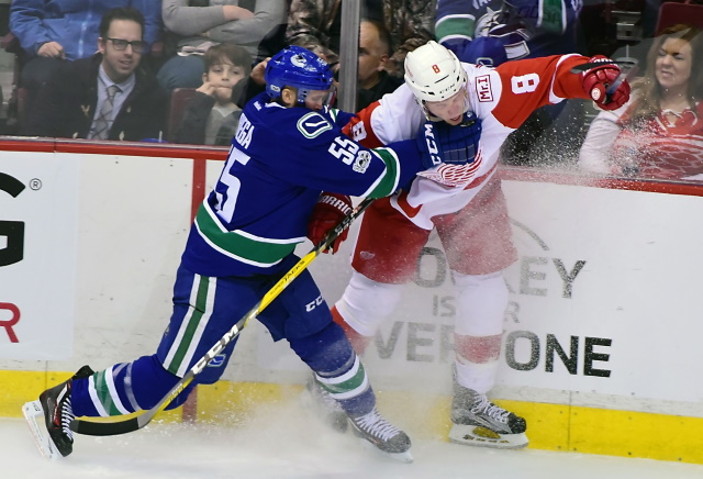 The Vancouver Canucks have traded Alex Biega to the Detroit Red Wings.