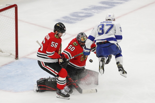 Chicago Blackhawks defenseman Erik Gustafsson and goaltender Corey Crawford