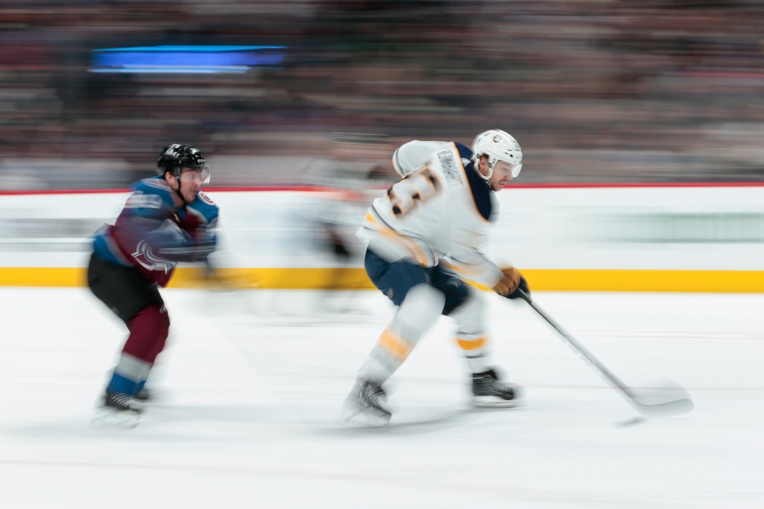 Sam Reinhart of the Buffalo Sabres and Dan Girard of the Colorado Avalanche