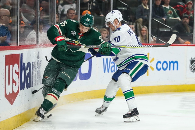 Elias Pettersson of the Vancouver Canucks and Jonas Brodin of the Minnesota Wild