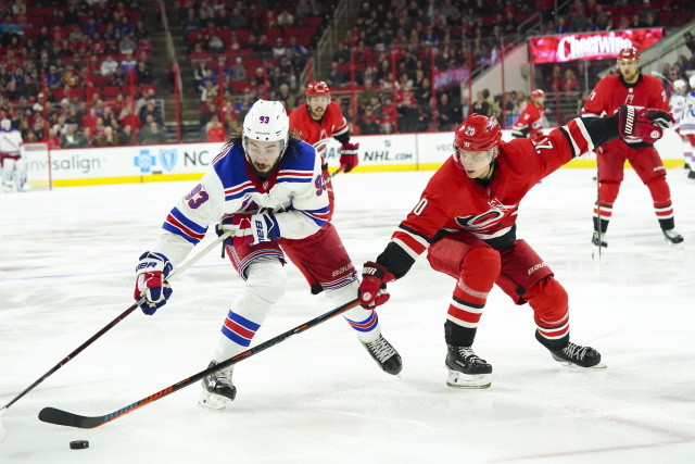 Sebastian Aho of the Carolina Hurricanes and Mika Zibanejad of the New York Rangers