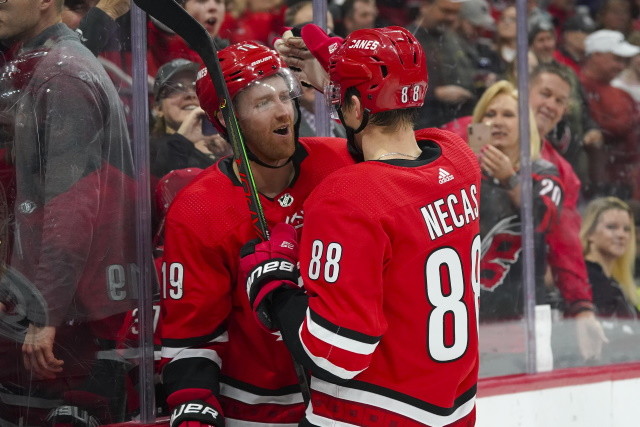 Dougie Hamilton and Martin Necas of the Carolina Hurricanes