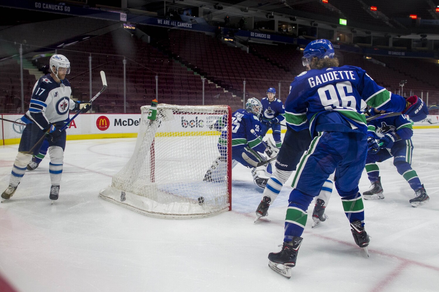 Flames sign College free agent. COVID protocol list. Vancouver Canucks re-opening delayed. Predators Michael McCarron suspended.