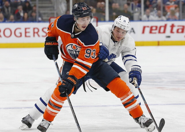 Ryan Nugent-Hopkins and Ken Holland of the Edmonton Oilers do a dance.