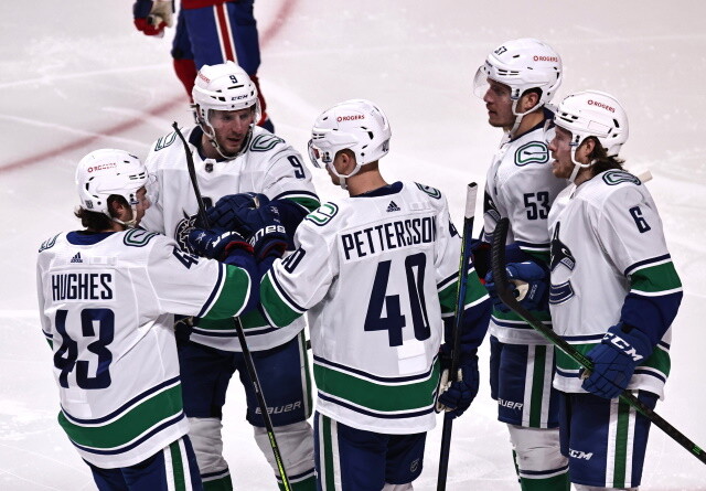 Travis Hamonic doesn't opt-out. The Vancouver Canucks officially sign restricted free agents Elias Pettersson and Quinn Hughes.