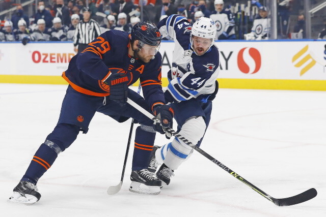 Islanders want games postponed. Devils claim Nathan Bastian. Panthers extend Rayn Lomberg. Nikita Zaitsev, Max Domi and Josh Morrissey fined.