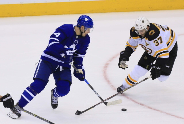 Patrice Bergeron leaves after crashing into the boards. Nathan MacKinnon could return on Sunday. Auston Matthews could skate today.